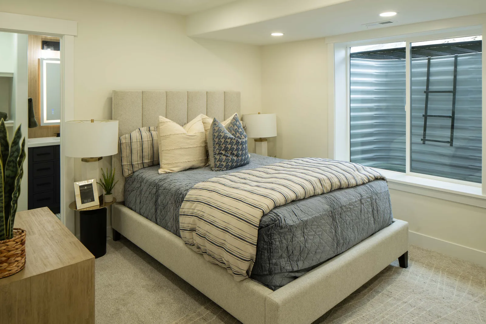 Striped bedding, oak dresser