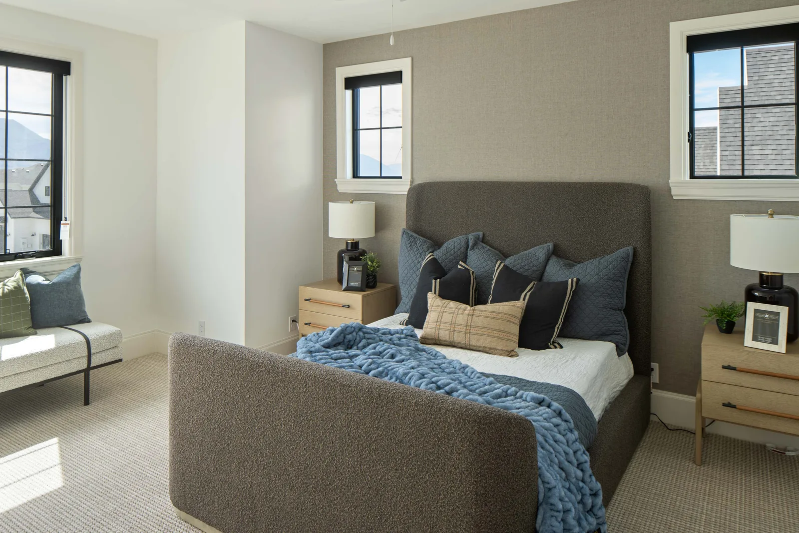 Gray boucle bed, blue textiles