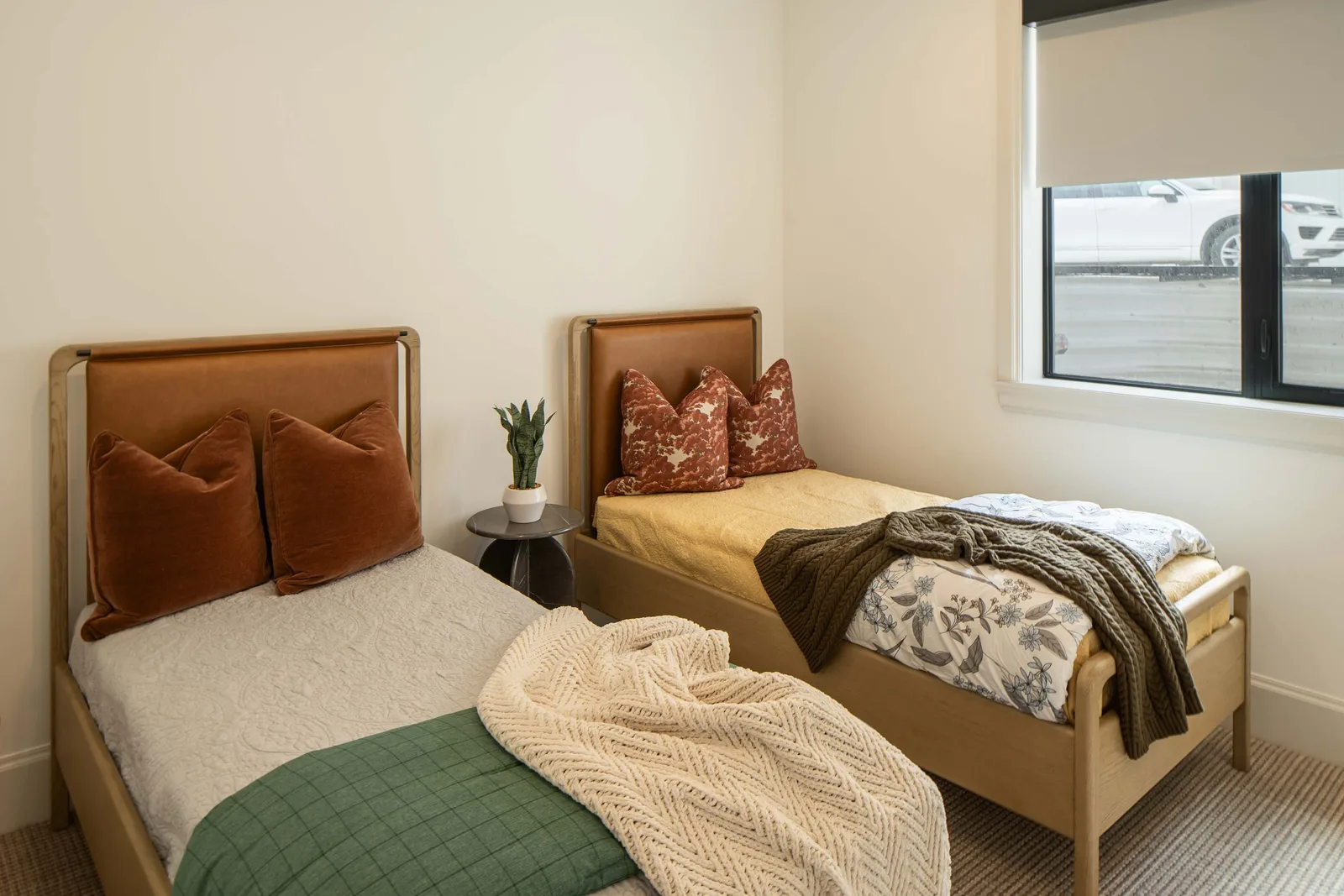 Twin leather-headboard beds