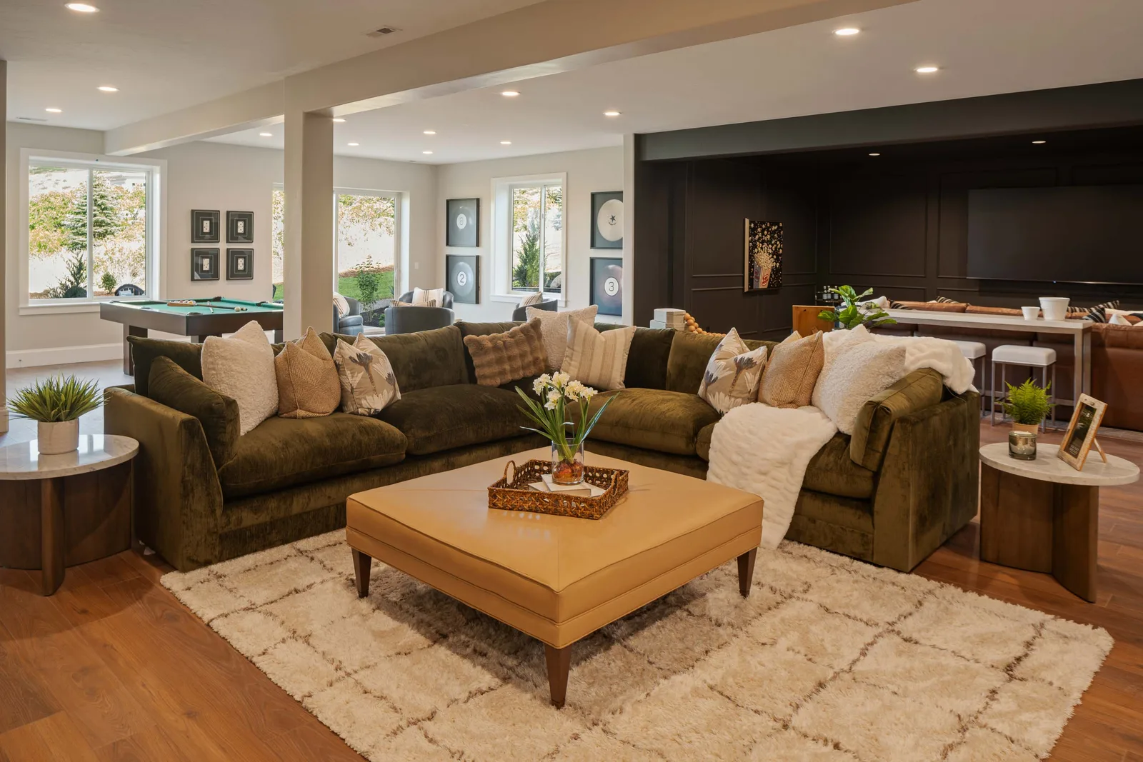 Olive velvet and a leather ottoman