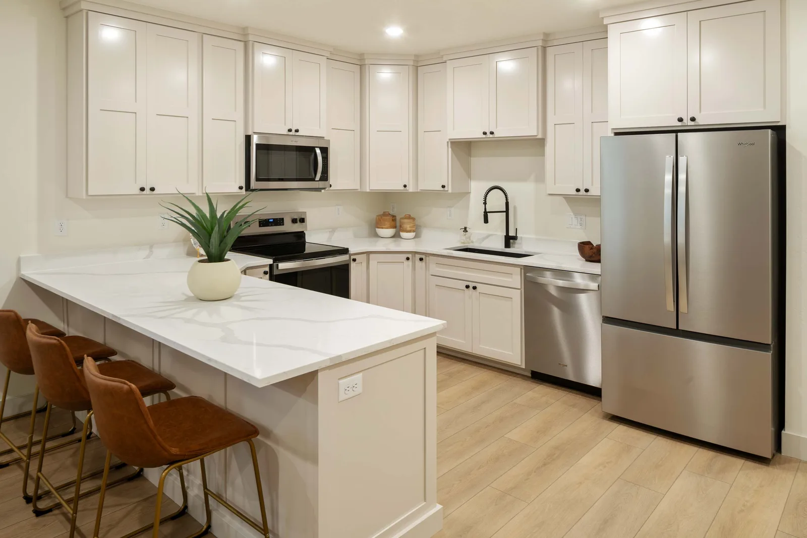 Cream kitchen, leather stools
