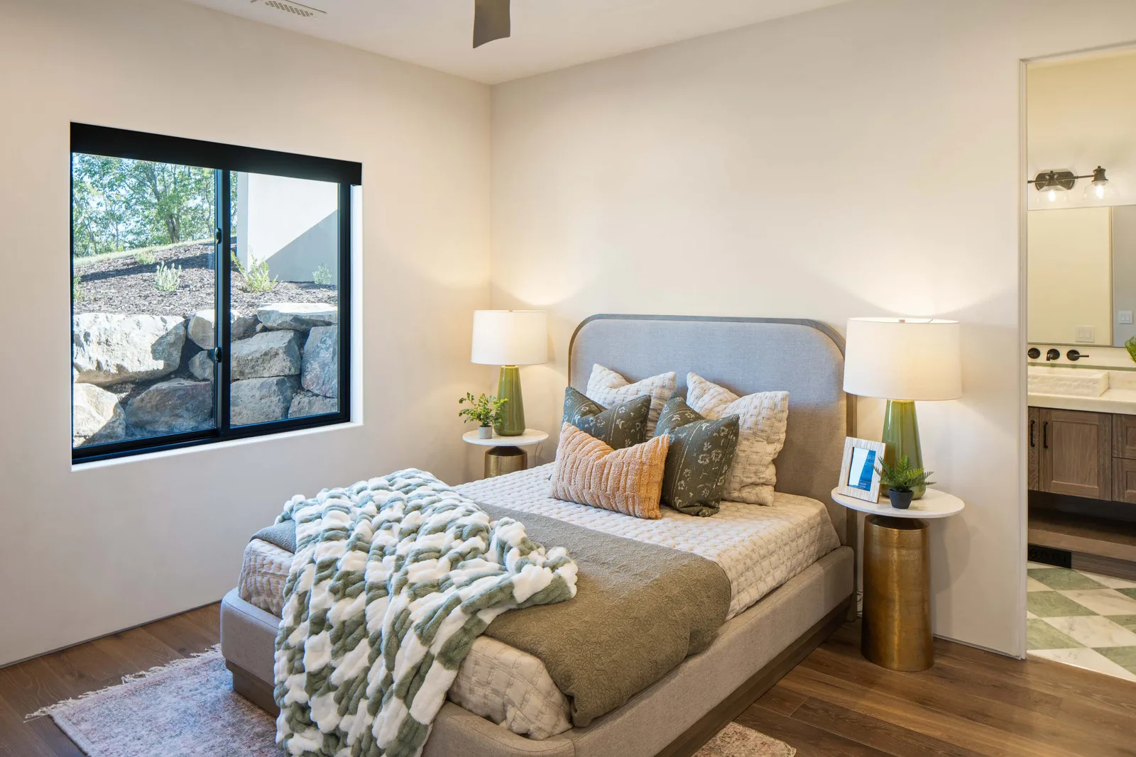 Grey bed, green accents